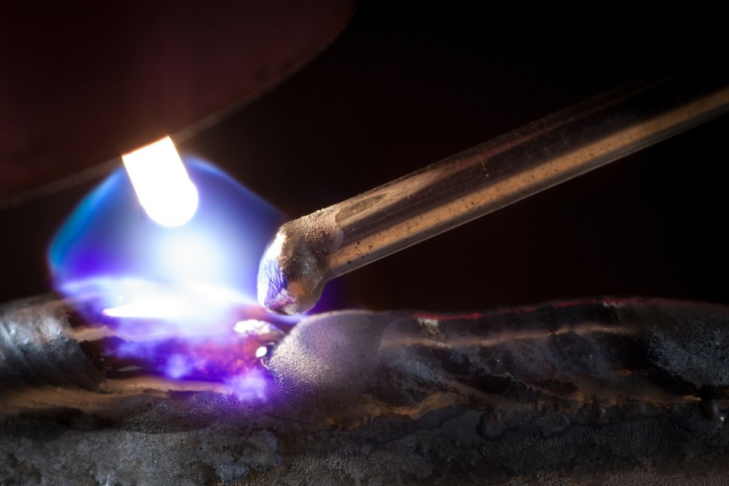 close up tig welding rod with shielding gas