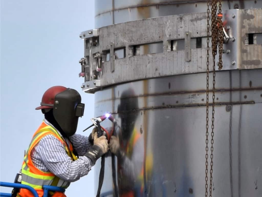 Image of SpaceX's welding engineer using a modified manual TIG welding process to join special stainless steel alloys for the Starship rocket designed for the crewed Mars mission.